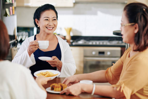 istock Senior woman talking to friends 1282589721