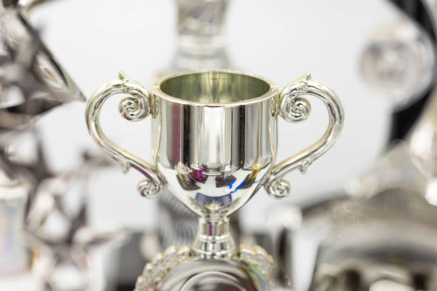 Success Concept WIth Brightly Lit Trophies