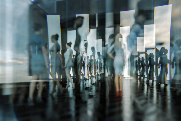 istock Abstract people silhouettes against glass 1282596397