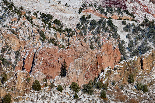 Huge, tall Rock formations after winter snow on edge of Pikes Peak National forest - Garden of the Gods in Colorado Springs, Colorado Rocky Mountain front range in western USA.