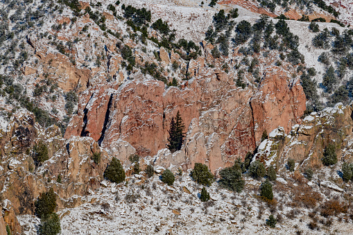 Huge, tall Rock formations after winter snow on edge of Pikes Peak National forest - Garden of the Gods in Colorado Springs, Colorado Rocky Mountain front range in western USA.