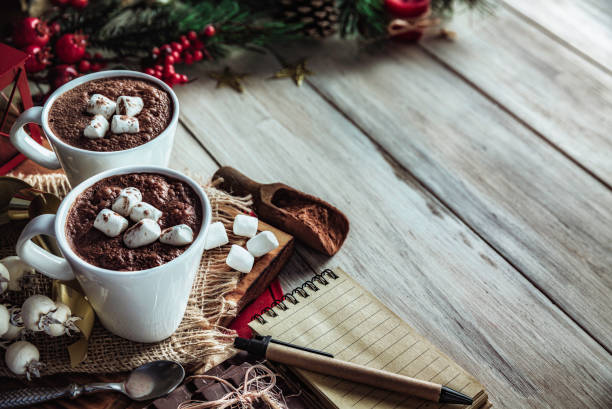 istock Christmas table setup with homemade chocolate mug with marshmallows with copy space on white rustic table 1282609291