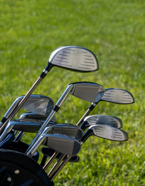 istock Golf sticks on green grass golf course, close up view. 1282613203