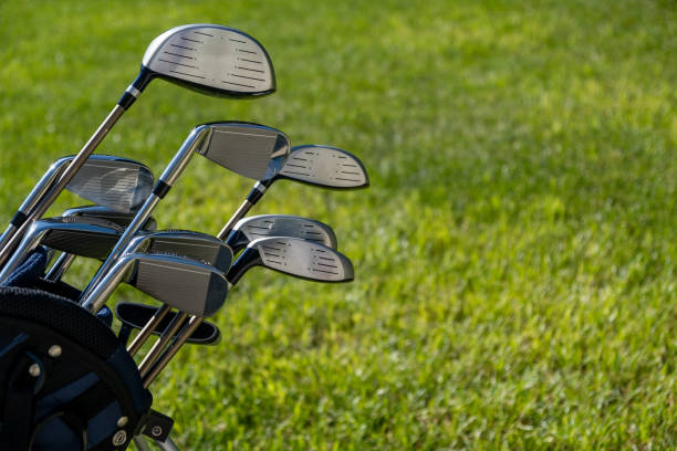 istock Golf sticks on green grass golf course, close up view. 1282613204