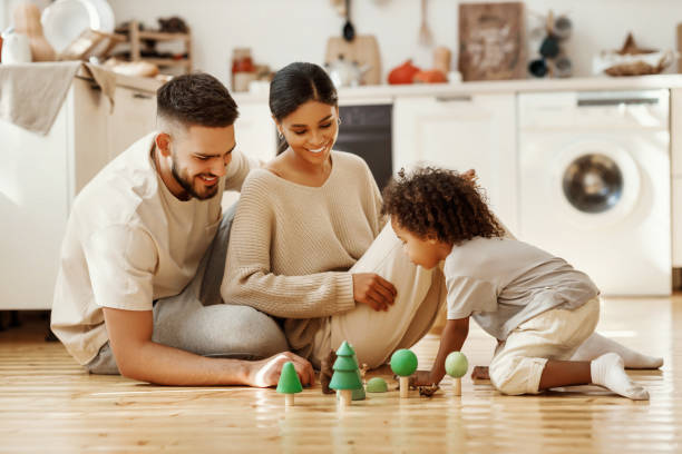 istock Diverse parents playing with son in kitchen 1282618172