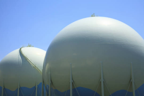 A sewage plant with blue illumination at night, looking surreal like an extraterrestial space ship.