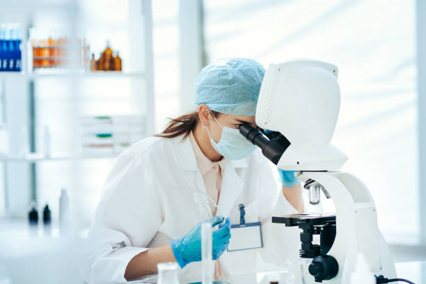 istock close up. female scientist looking through a microscope 1282638618