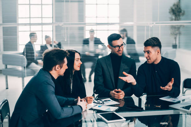 istock young employee explaining his ideas to colleagues 1282638672