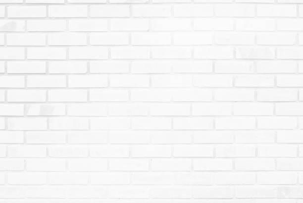 istock White brick wall texture background in room at subway. Brickwork stonework interior, rock old concrete grid uneven abstract weathered grey clean tile design, horizontal architecture wallpaper. 1282644869