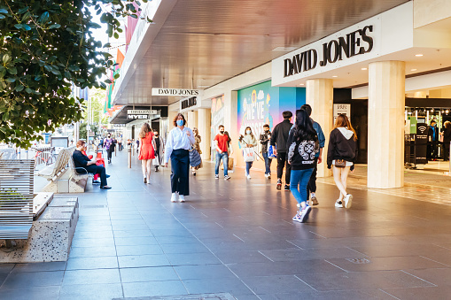 Melbourne, Australia - October 28, 2020: Cafes and retail shops reopen and crowds flock to Melbourne city. Bourke St Mall is crowded and joyous at the first day of shopping in nearly 3 months.