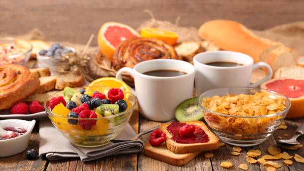istock breakfast with coffee cup, fresh fruit, cereal and bread 1282645397