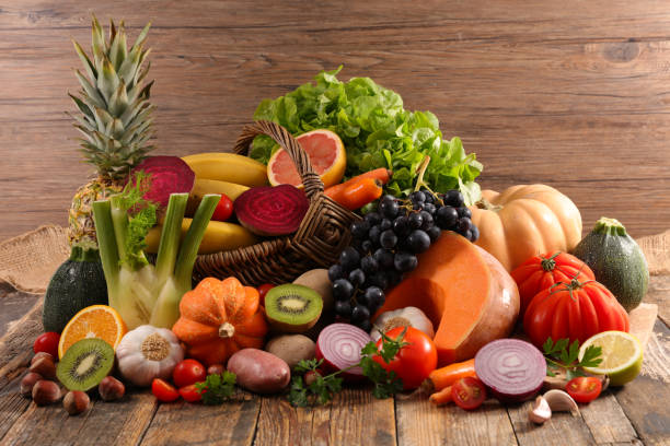 istock fruit and vegetable on wood background 1282645419