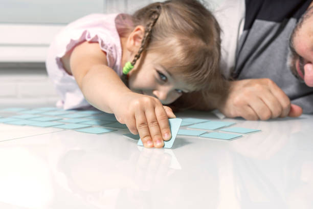 dad and little daughter play together Memo cards for early childhood memory development/ dad and little daughter play together memories stock pictures, royalty-free photos & images