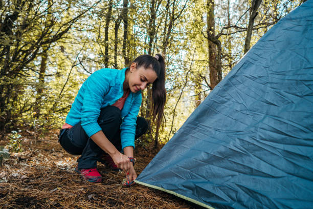istock Setting up a tent 1282648723