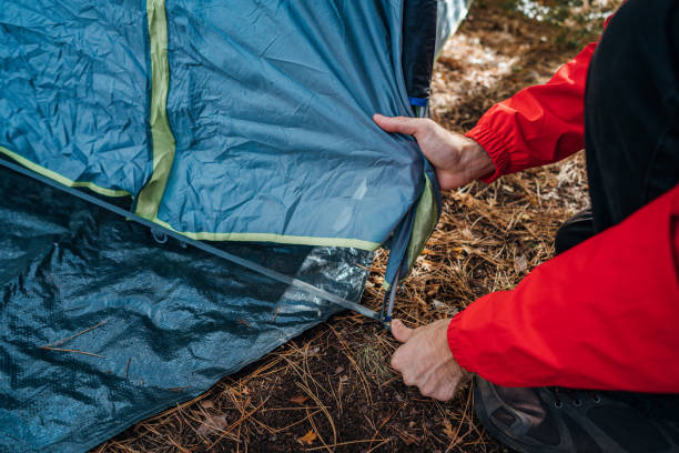 istock Setting up a tent 1282648724