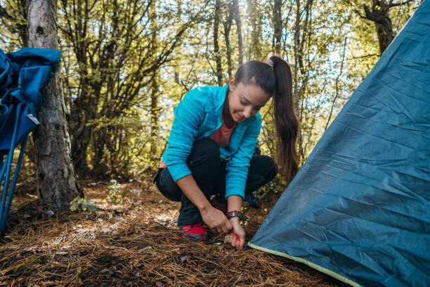 istock Setting up a tent 1282648771
