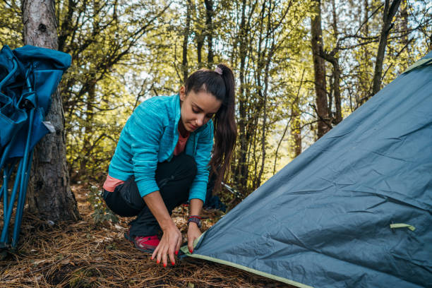 istock Setting up a tent 1282648819