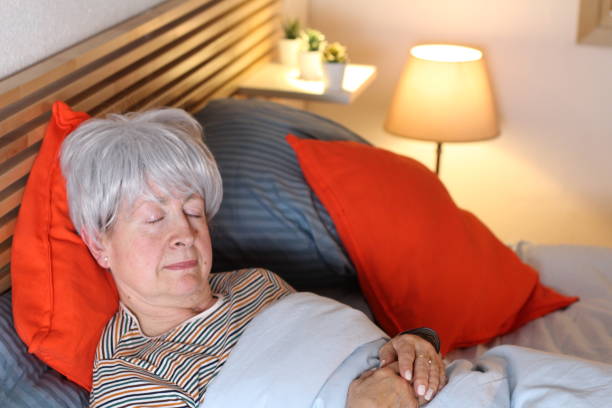 istock Senior woman peacefully sleeping alone 1282650933