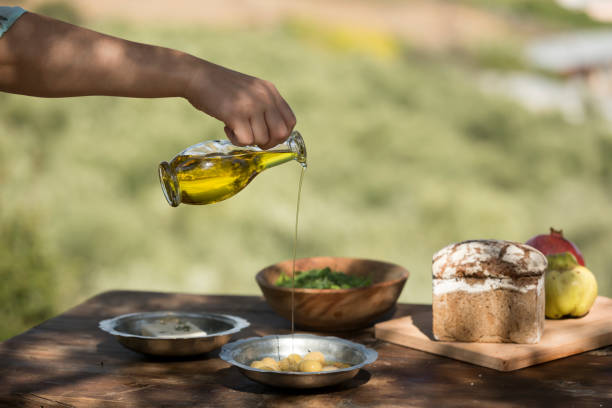 istock pouring olive oil with bottle 1282651558