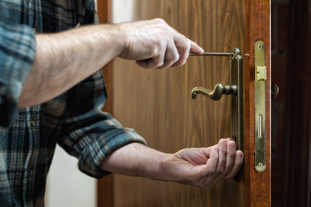 istock Carpenter at work repairs the door lock. Carpentry. 1282651768
