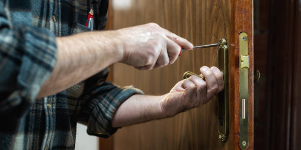 istock Carpenter at work repairs the door lock. Carpentry. 1282651769
