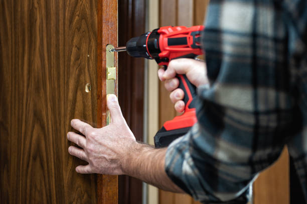 istock Carpenter at work repairs the door lock. Carpentry. 1282651770