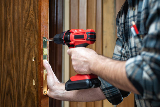 istock Carpenter at work repairs the door lock. Carpentry. 1282651776