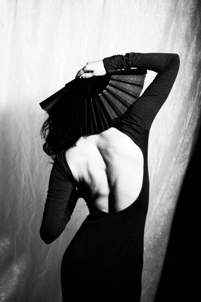 istock Woman with a fan in black and white 1282651890