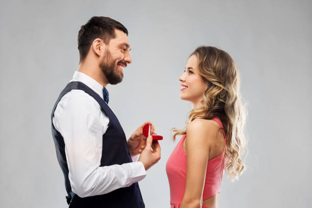 istock man giving woman engagement ring on valentines day 1282651974
