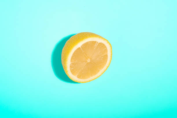 istock Lemon sliced isolated on blue minimal background, tropical citrus fruit 1282652626