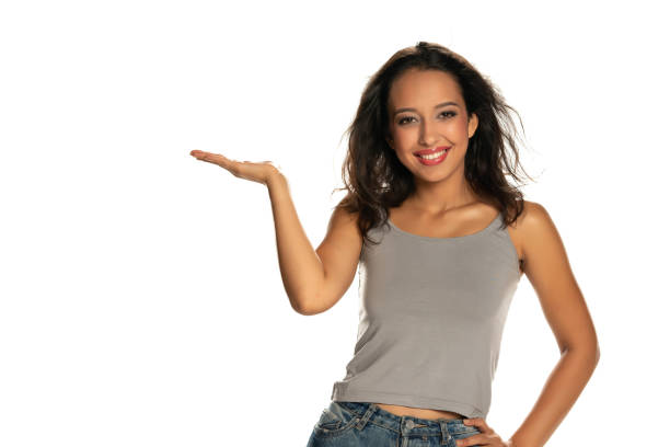 istock Happy dark skinned woman holding imaginary object 1282653459