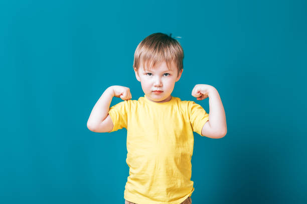 istock little strong boy portrait showing muscles mischief 1282654494
