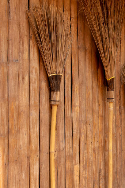 istock The broom is leaning against a wooden wall. 1282654513