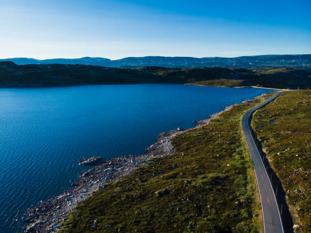 istock Road crossing Hardangervidda plateau, Norway. Aerial view. 1282654528
