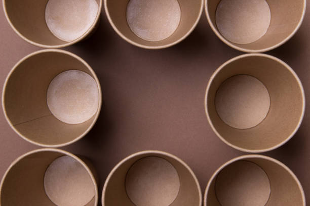 istock frame made of brown eco-friendly cardboard cups on brown background with copy space inside 1282657520