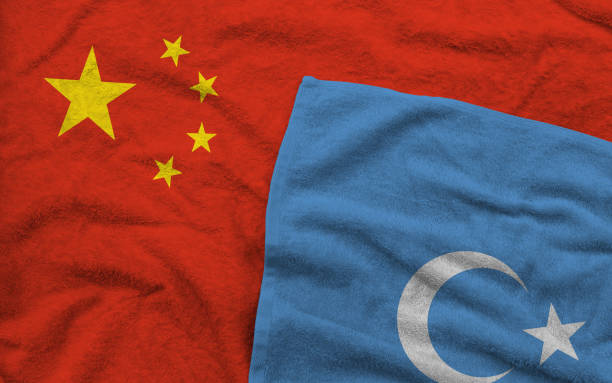 The Chinese and Uyghur flags pattern on towel fabric are placed together. stock photo
