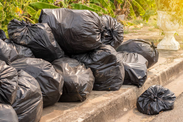 istock Many black plastic bags filled with garbage. 1282660645
