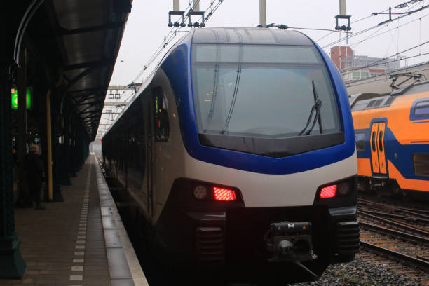 istock White with blue train commonly found in the netherlands, those trains usually stop at every village 1282662292