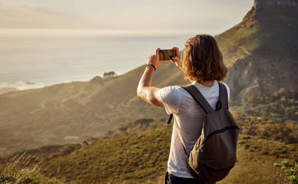 istock Young Hiker Photographing From The Mountain Top 1282662942