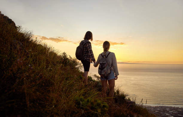 istock Young Couple Enjoy The View From The Mountains 1282662965