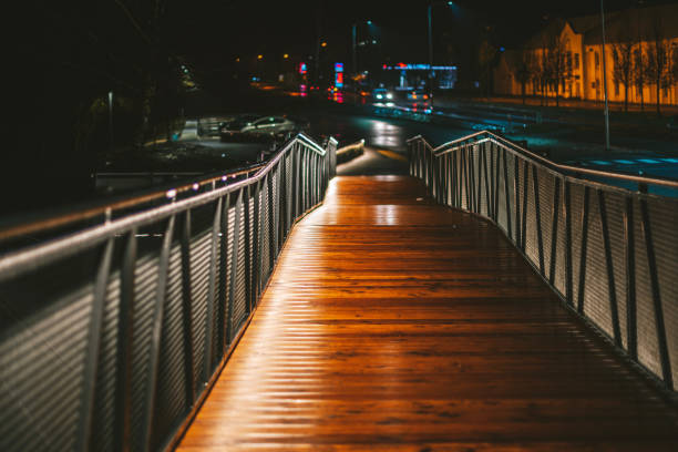 istock Illuminated Footbridge In City At Night 1282664578