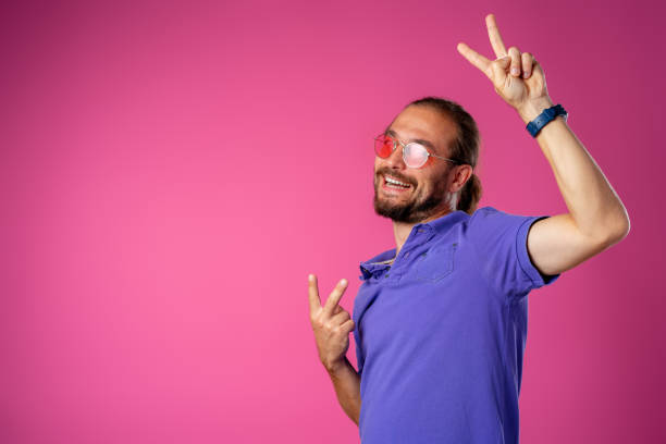 istock Cool long haired joyful man wearing glasses 1282666054