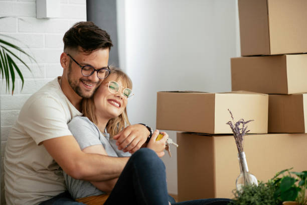 istock Happy couple is unpacking their belongings 1282667559