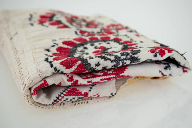istock Vintage embroidered fabric on white background 1282667736