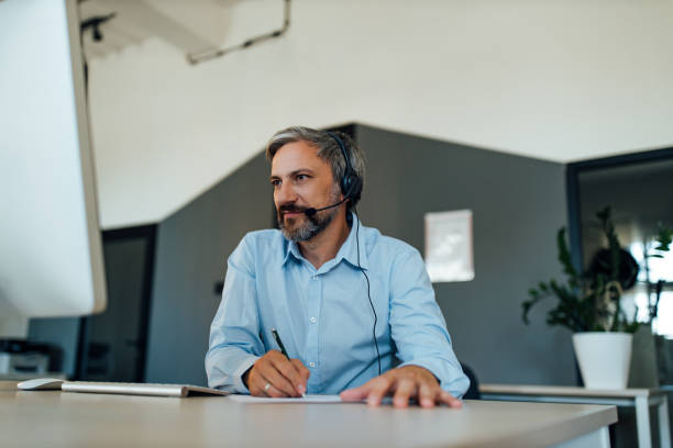 istock Man reading news online, taking break from work. 1282670296