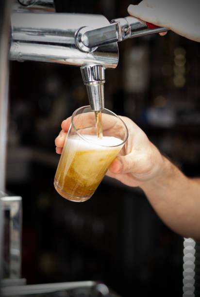 istock A bartender pouring draft beer into a glass 1282672027
