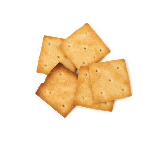 istock baked square crispy cracker cookies isolated on white background 1282674549