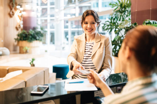 istock Businesswoman checking in at Hotel Reception 1282674853