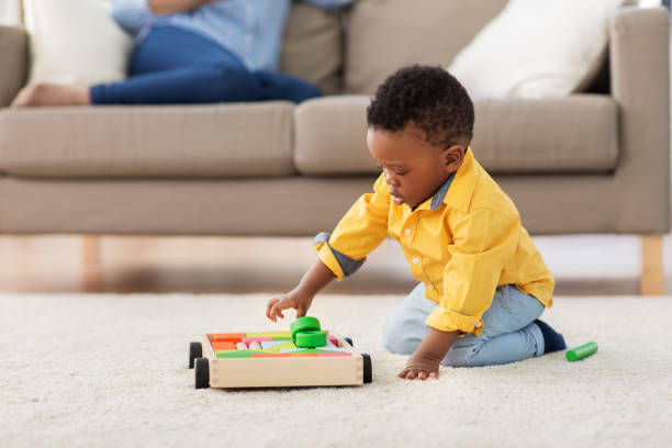 istock african american baby boy playing with toy blocks 1282678095