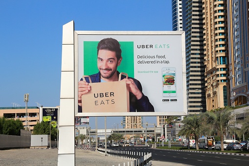 Billboard advertisement of Uber Eats food delivery service app in Dubai city, United Arab Emirates.